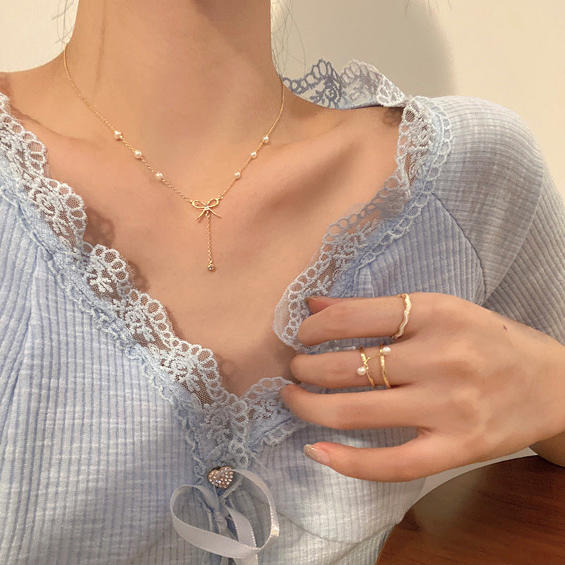 Elegant Bow Pendant Necklace with Long Fringe Design for Women