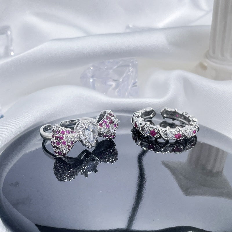 Sweet & Edgy Bow Ring with Red Zircon Accents - Adjustable Open Ring for Women