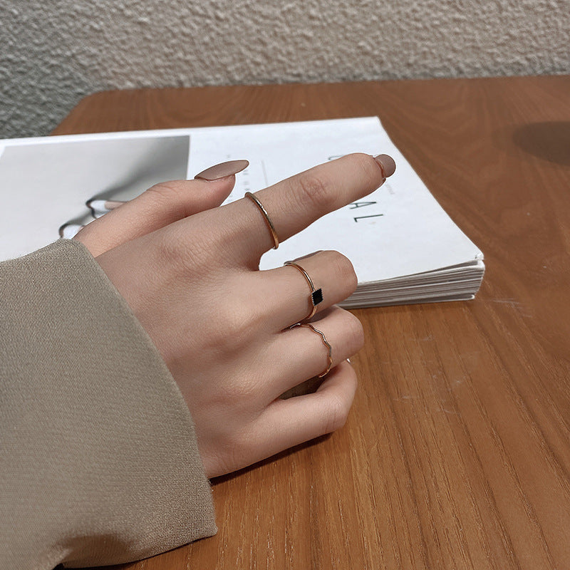 Geometric Black Zirconia Stackable Ring Set in Gold-Tone with Minimalist Design