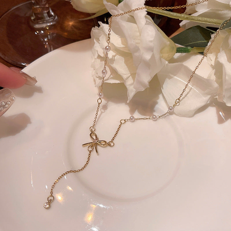 Elegant Bow Pendant Necklace with Long Fringe Design for Women
