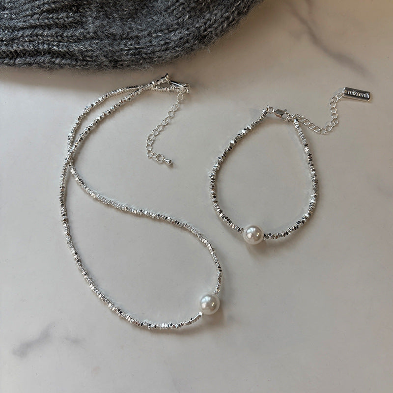 Elegant Pearl and Silver Bracelet and Necklace Set with Geometric Design