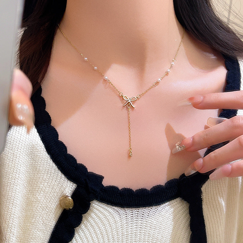 Elegant Bow Pendant Necklace with Long Fringe Design for Women