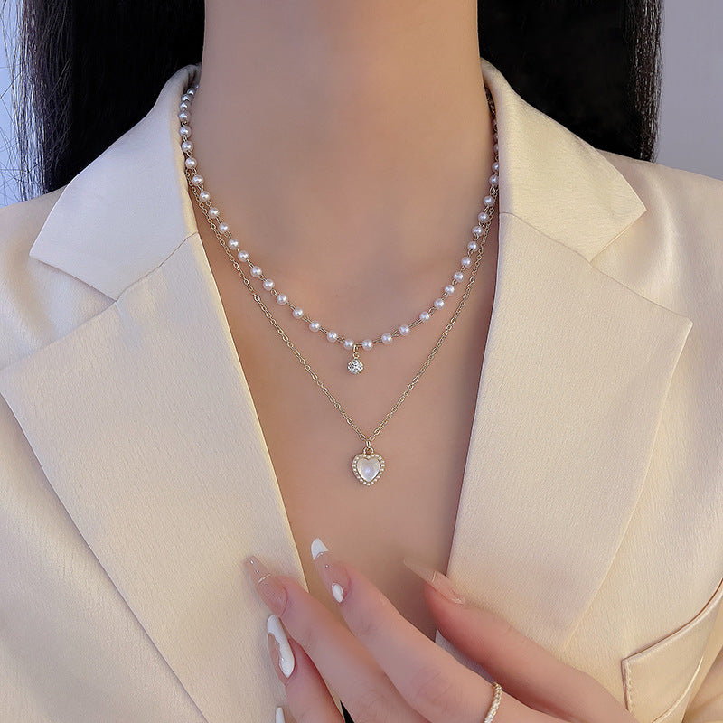 Layered Pearl and Mother-of-Pearl Pendant Necklace with Heart Design in X900 Gold Tone