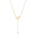 Bow and Tassel Pendant Necklace with Geometric Design in Gold Tone