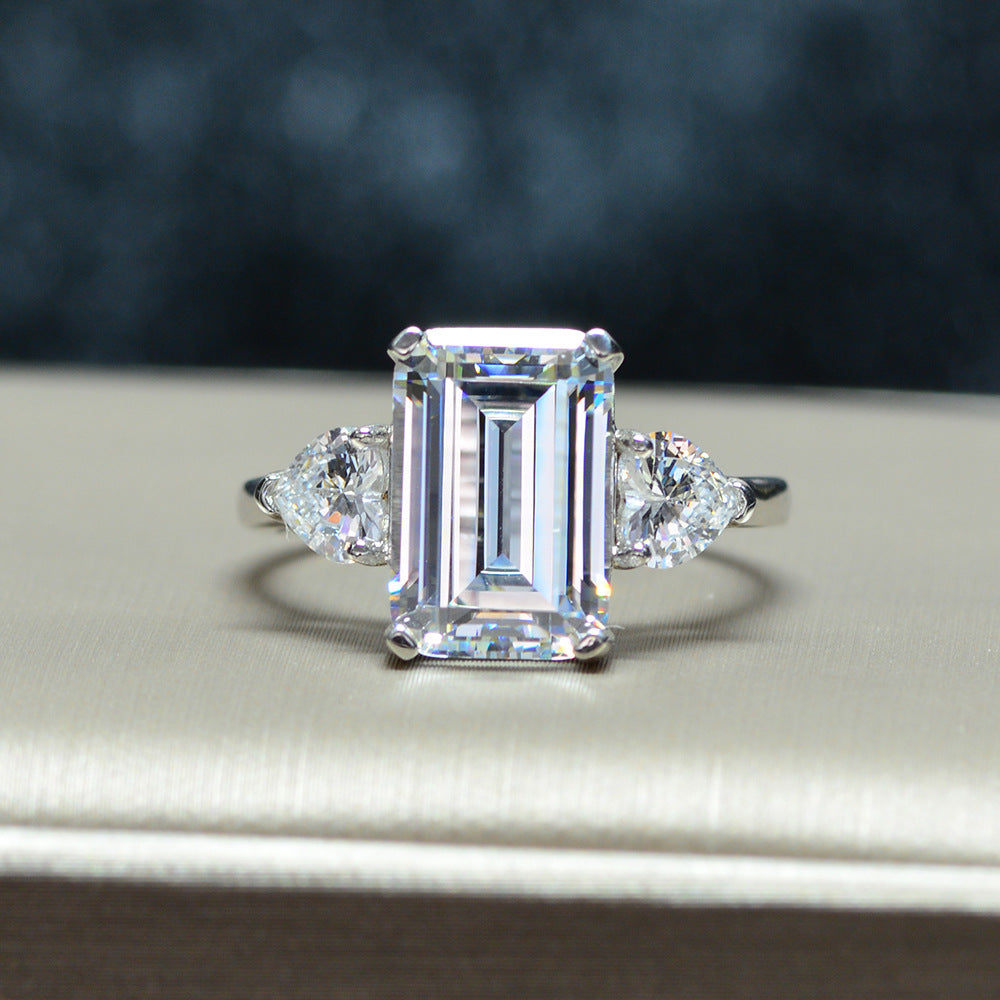 925 sterling silver  featuring a rectangular center stone flanked by teardrop shaped side stones, for a total of three stones  Ring